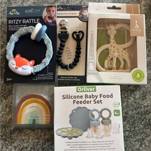 Teethers, rattle, binky strap and baby food feeder set